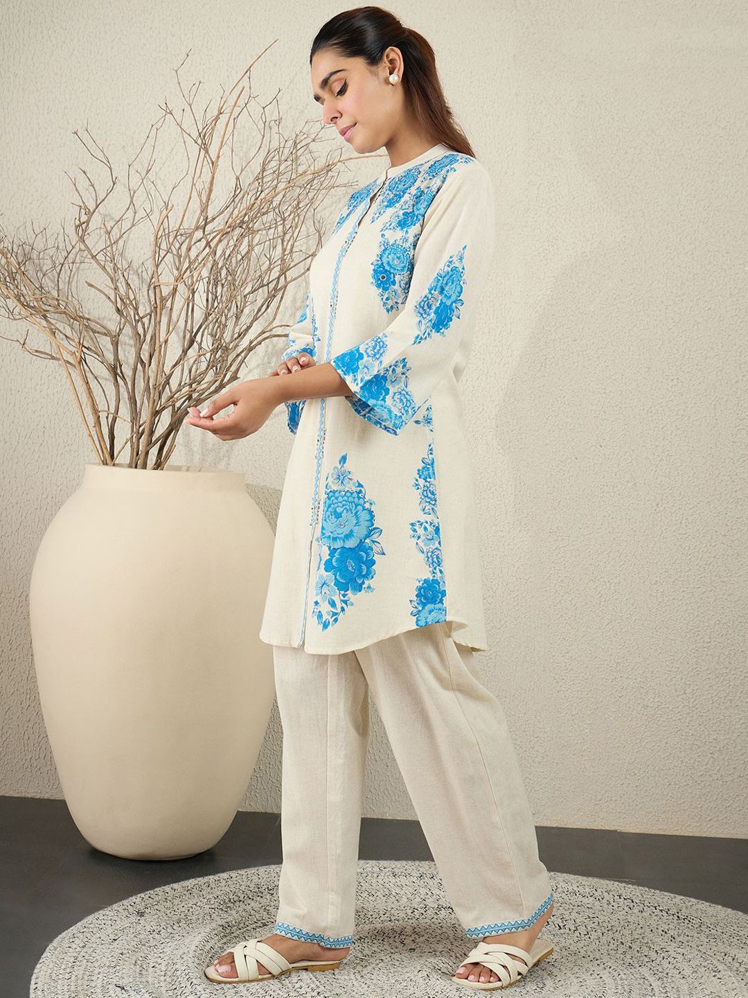 Women Floral Printed Cotton Kurta with Trousers