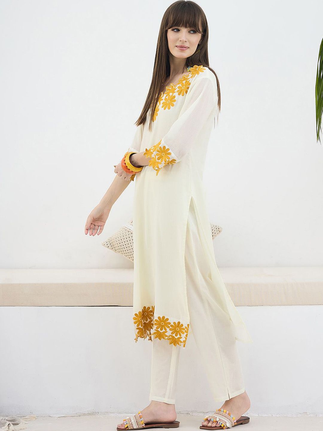 Women Floral Embroidered Cotton Kurta with Trousers