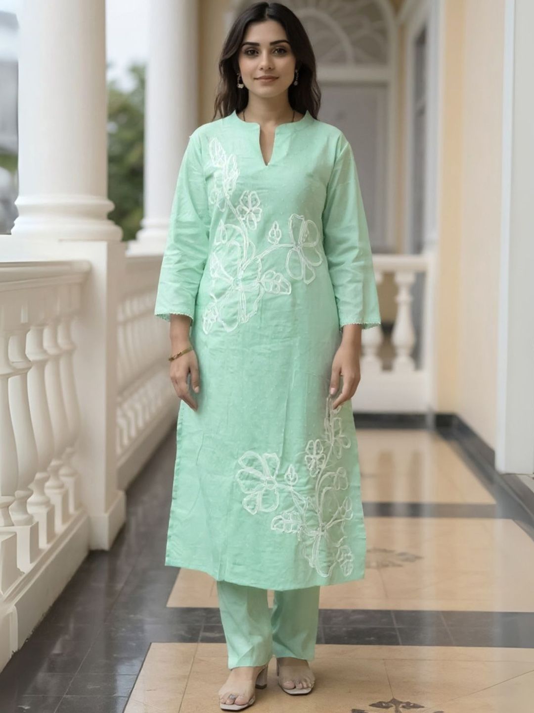 Women Floral Embroidered Cotton Kurta with Trousers