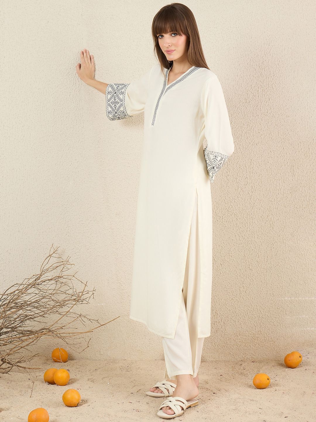 Women Solid Embroidered Kurta with Trousers