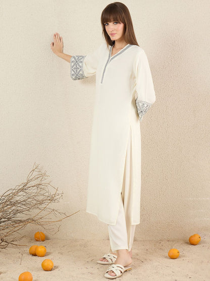 Women Solid Embroidered Kurta with Trousers