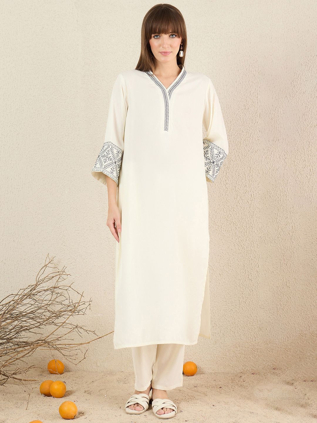 Women Solid Embroidered Kurta with Trousers