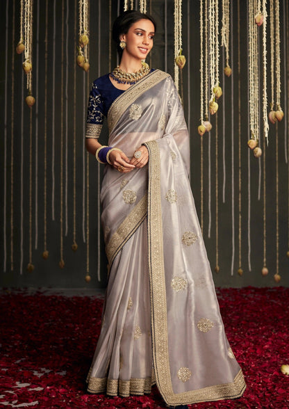 Dhiyona KM Women Soft Tissue Silk Saree With Intricate Silver Embroidery & Contrast Blue Blouse