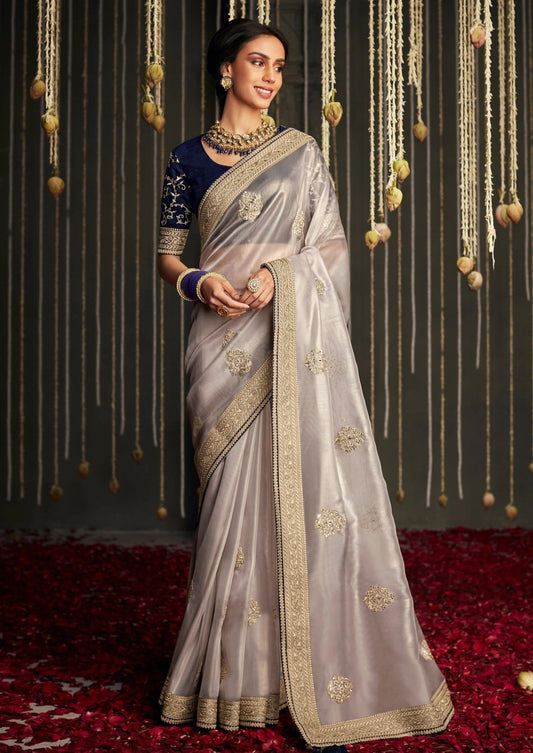 Dhiyona KM Women Soft Tissue Silk Saree With Intricate Silver Embroidery & Contrast Blue Blouse