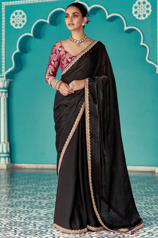 Dhiyona KM Women Black Tissue Silk Saree With Golden Border & Purple Blouse