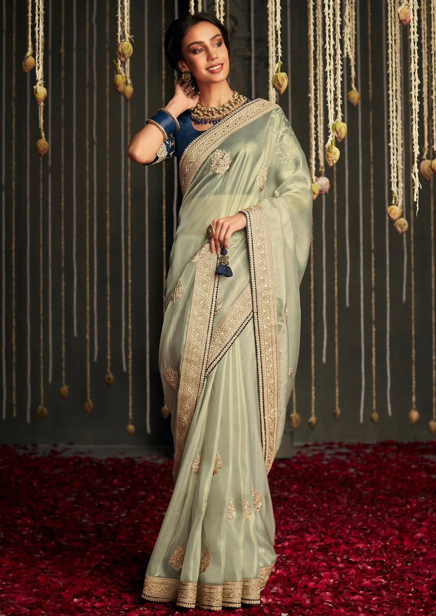 Dhiyona KM Women Elegant Light Green Designer Saree With Intricate Golden Work