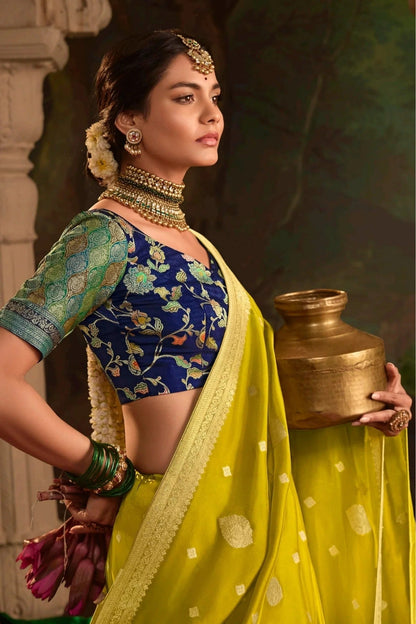 Dhiyona KM Women Yellow Banarasi Dola Silk Saree With Contrasting Blue Blouse