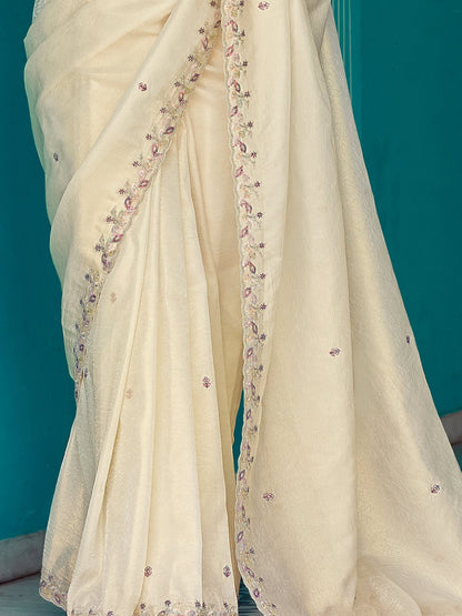 Dhiyona KM Women Cream Tissue Silk Saree With Sequins Work & Purple Contrast Blouse