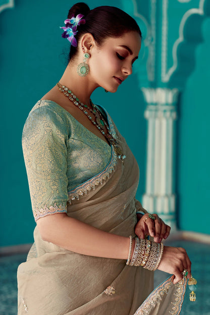 Dhiyona KM Women Beige Embroidery Tissue Silk Saree With Sea Green Blouse