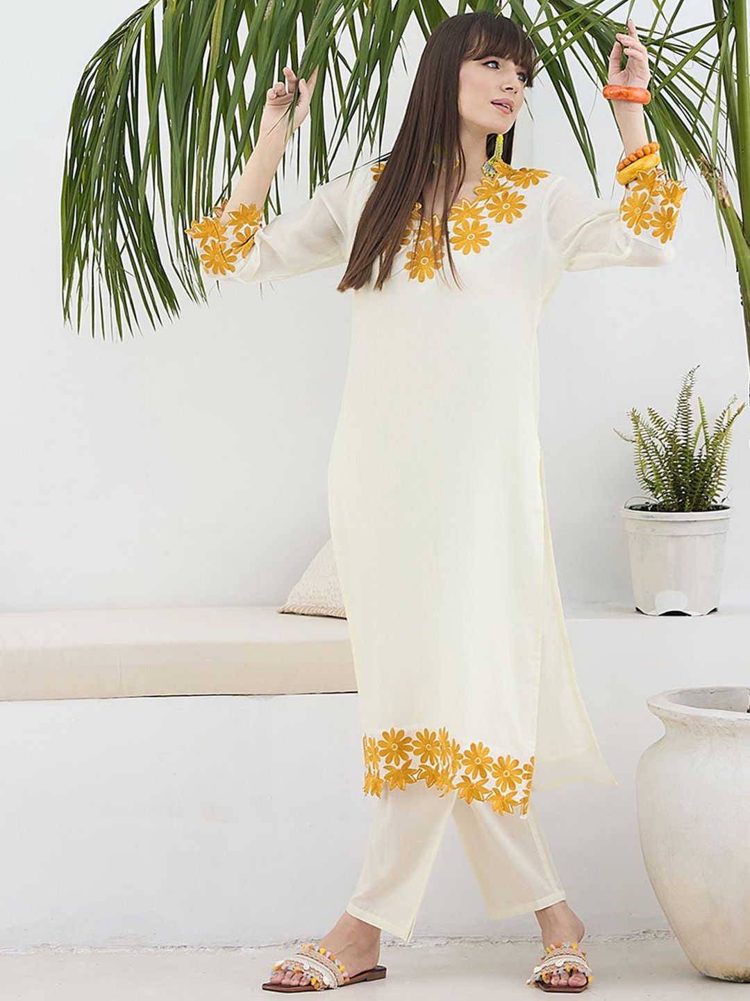 Women Floral Embroidered Cotton Kurta with Trousers