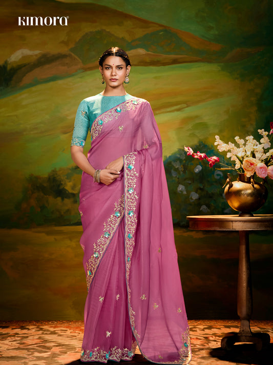 Dhiyona KM Women The Pink Silk Saree With Teal Blouse