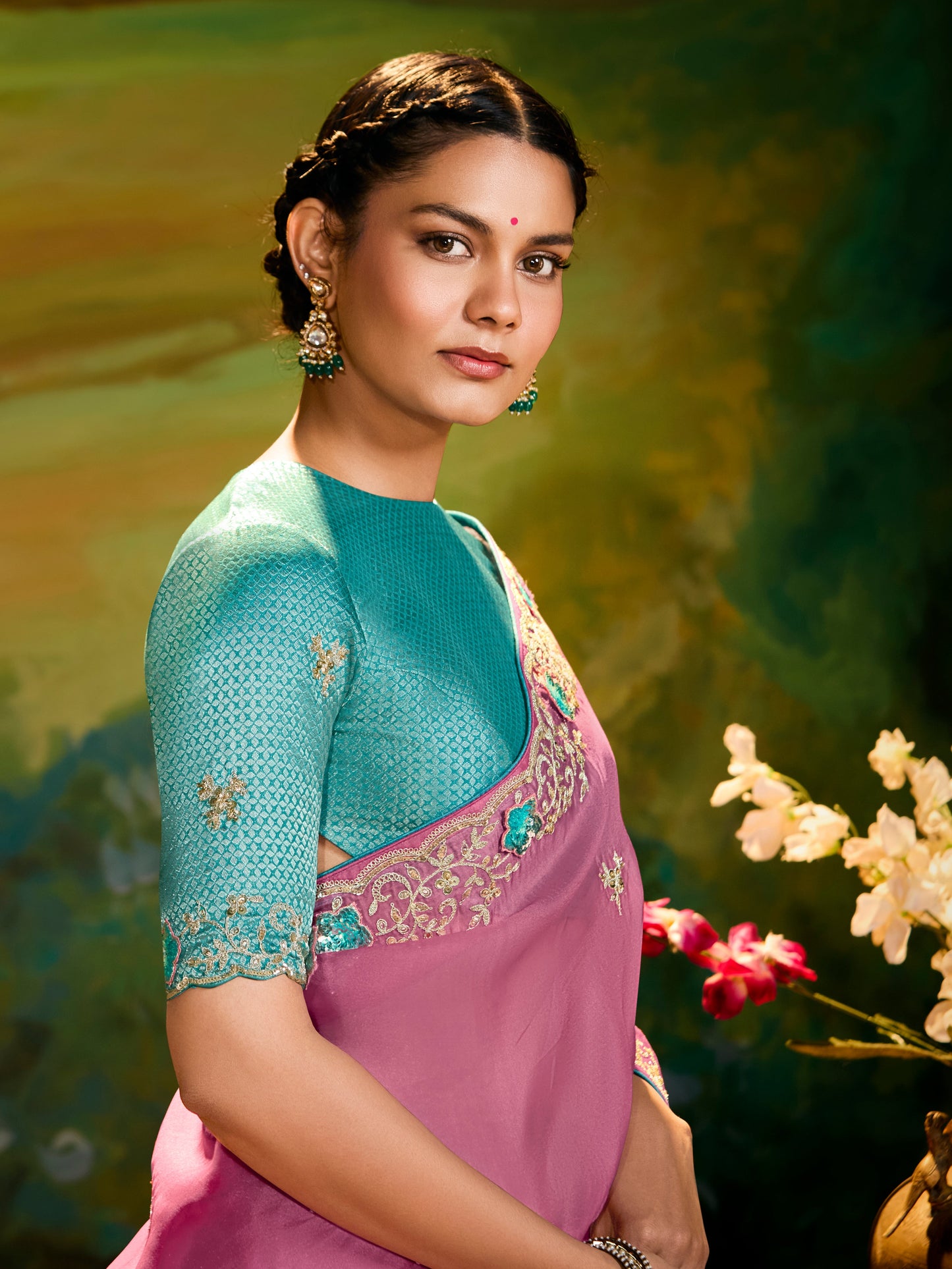 Dhiyona KM Women The Pink Silk Saree With Teal Blouse