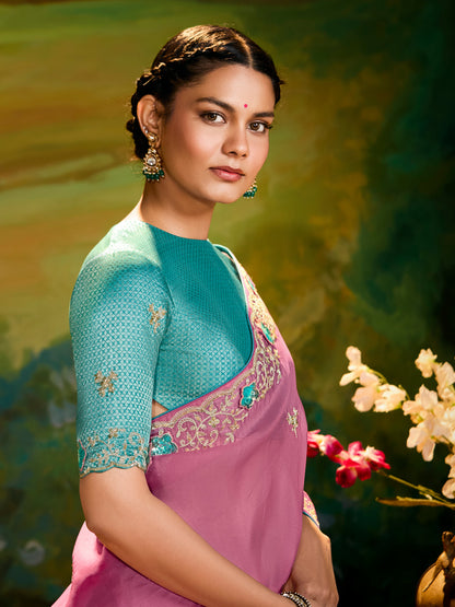 Dhiyona KM Women The Pink Silk Saree With Teal Blouse