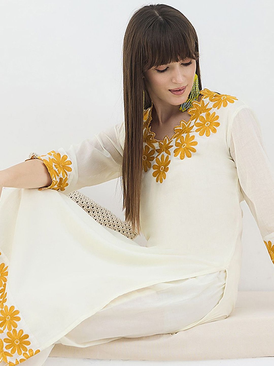 Women Floral Embroidered Cotton Kurta with Trousers