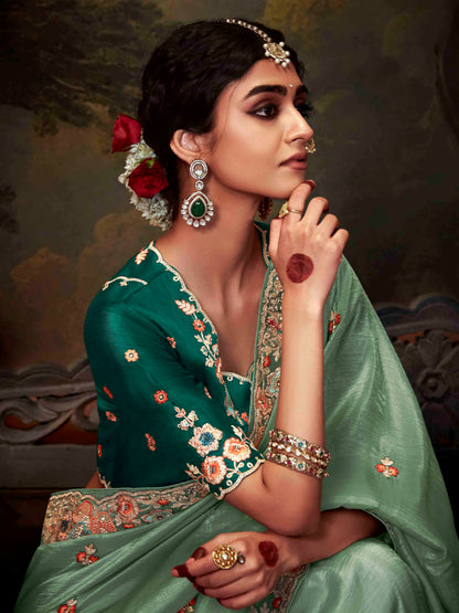 Dhiyona KM Women Regal Sea Green Tissue Silk Saree With Intricately Embroidered Bottle Green Blouse