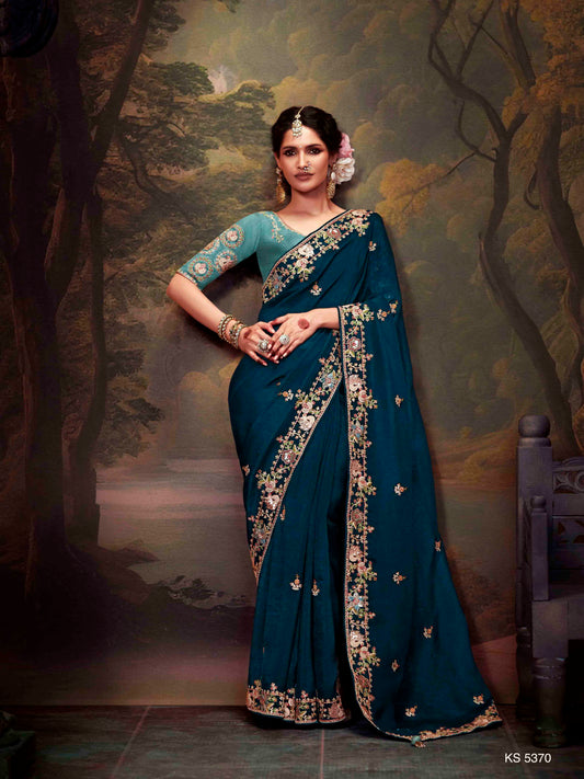 Dhiyona KM Women Teal Blue Designer Organza Silk Saree With Heavy Embroidered Floral Border And Contrast Blouse