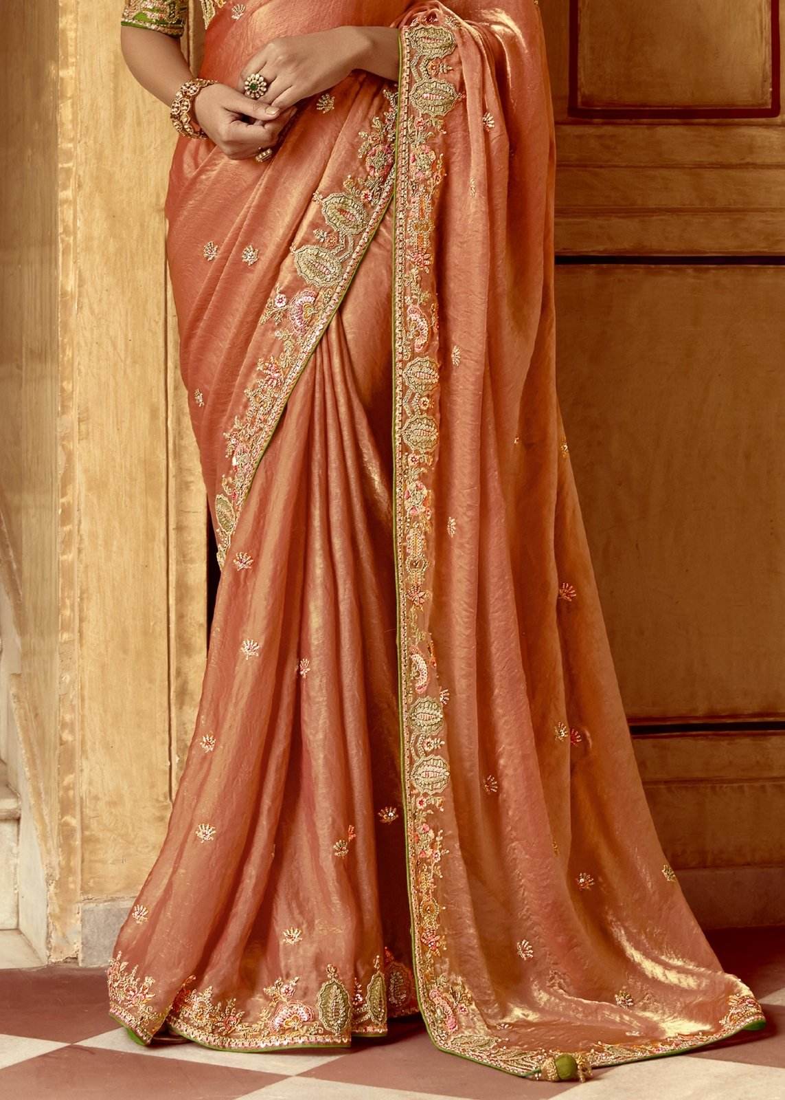 Dhiyona KM Women Peach Designer Tissue Silk Saree With Green Blouse