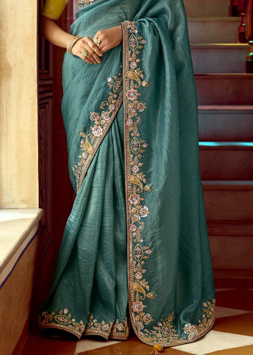 Dhiyona KM Women Teal Designer Tissue Silk Saree
