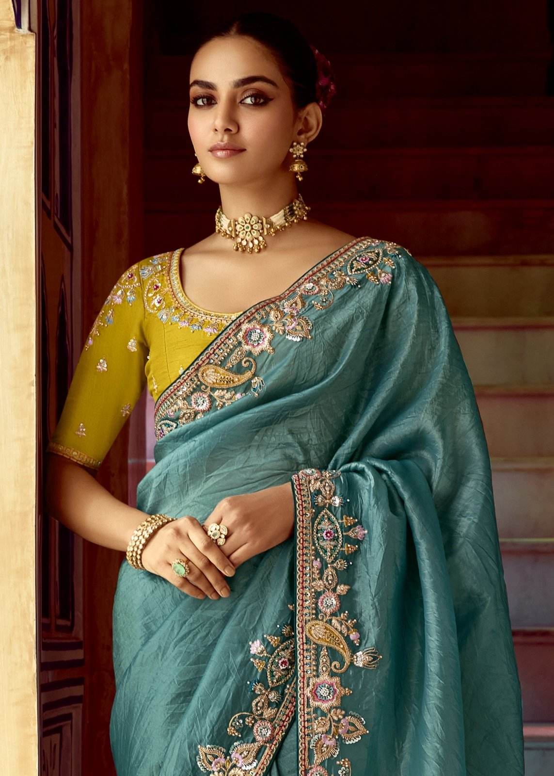 Dhiyona KM Women Teal Designer Tissue Silk Saree