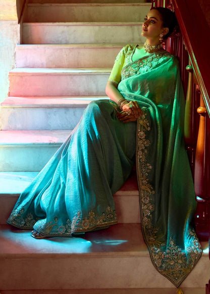 Dhiyona KM Women Teal Designer Tissue Silk Saree
