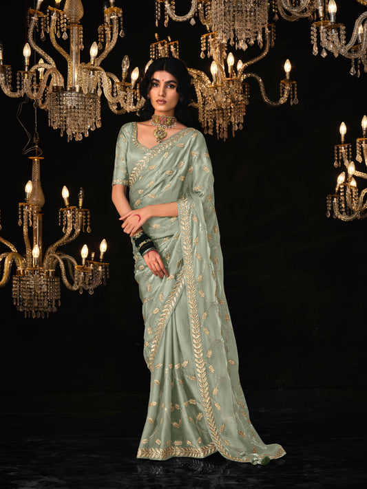 Dhiyona KM Women Olive Green Saree With Elegant Silver Embroidery