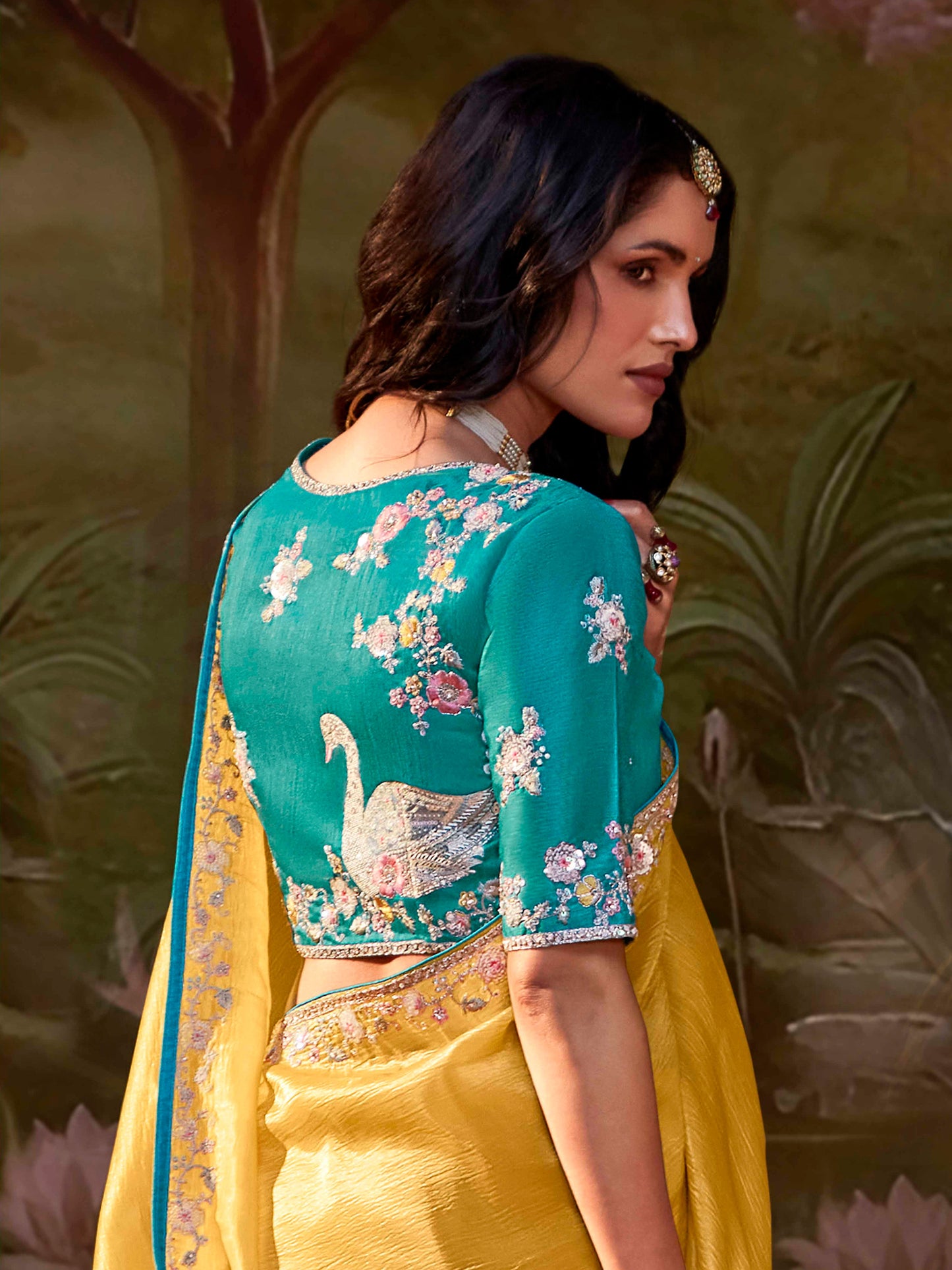 Dhiyona KM Women Yellow Silk Embroidered Butta Saree With Teal Blouse