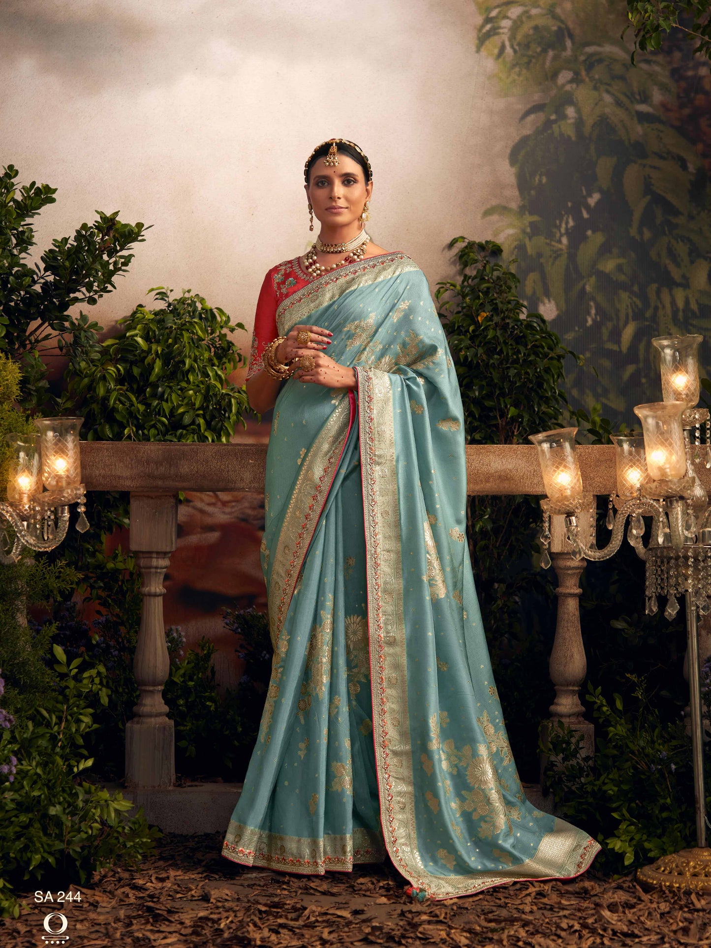 Dhiyona KM Women Light Blue Silk Zari Weaved Saree With Broad Border & Red Embroidered Blouse