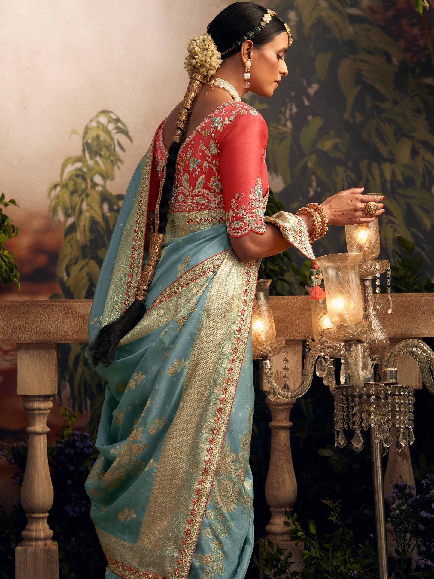 Dhiyona KM Women Light Blue Silk Zari Weaved Saree With Broad Border & Red Embroidered Blouse