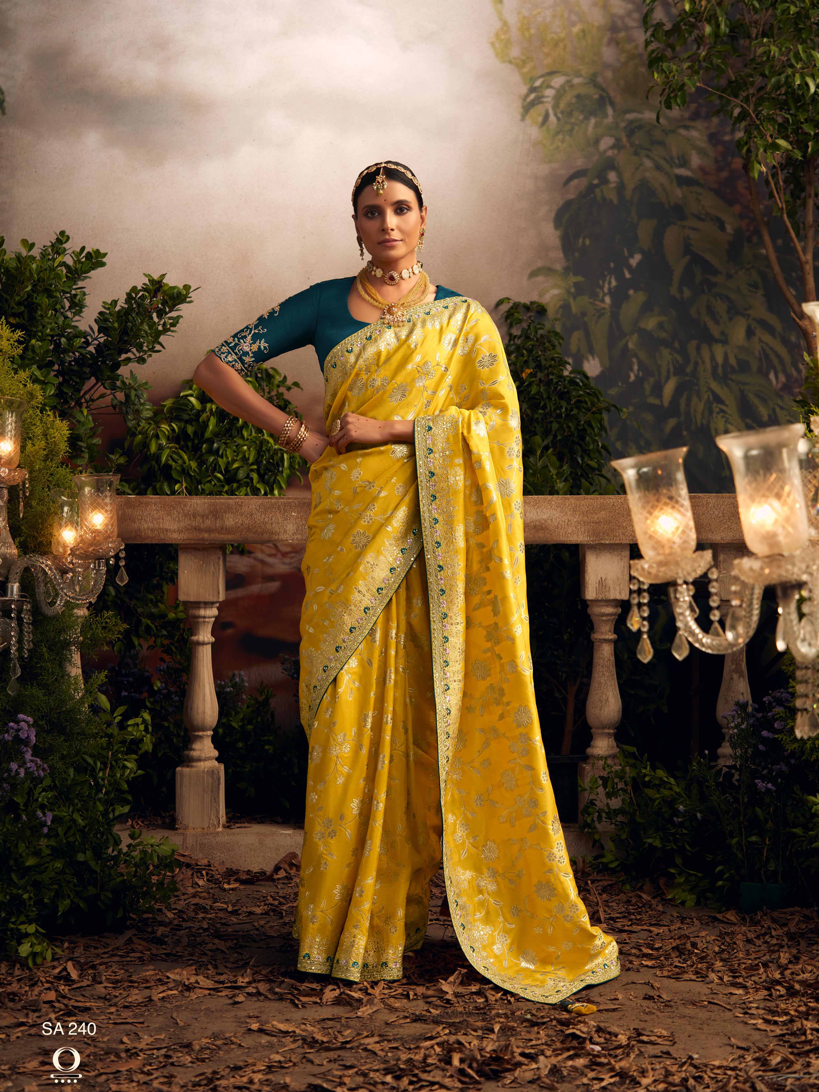 Dhiyona KM Women Vibrant Yellow Silk Saree With Teal Embroidered Blouse