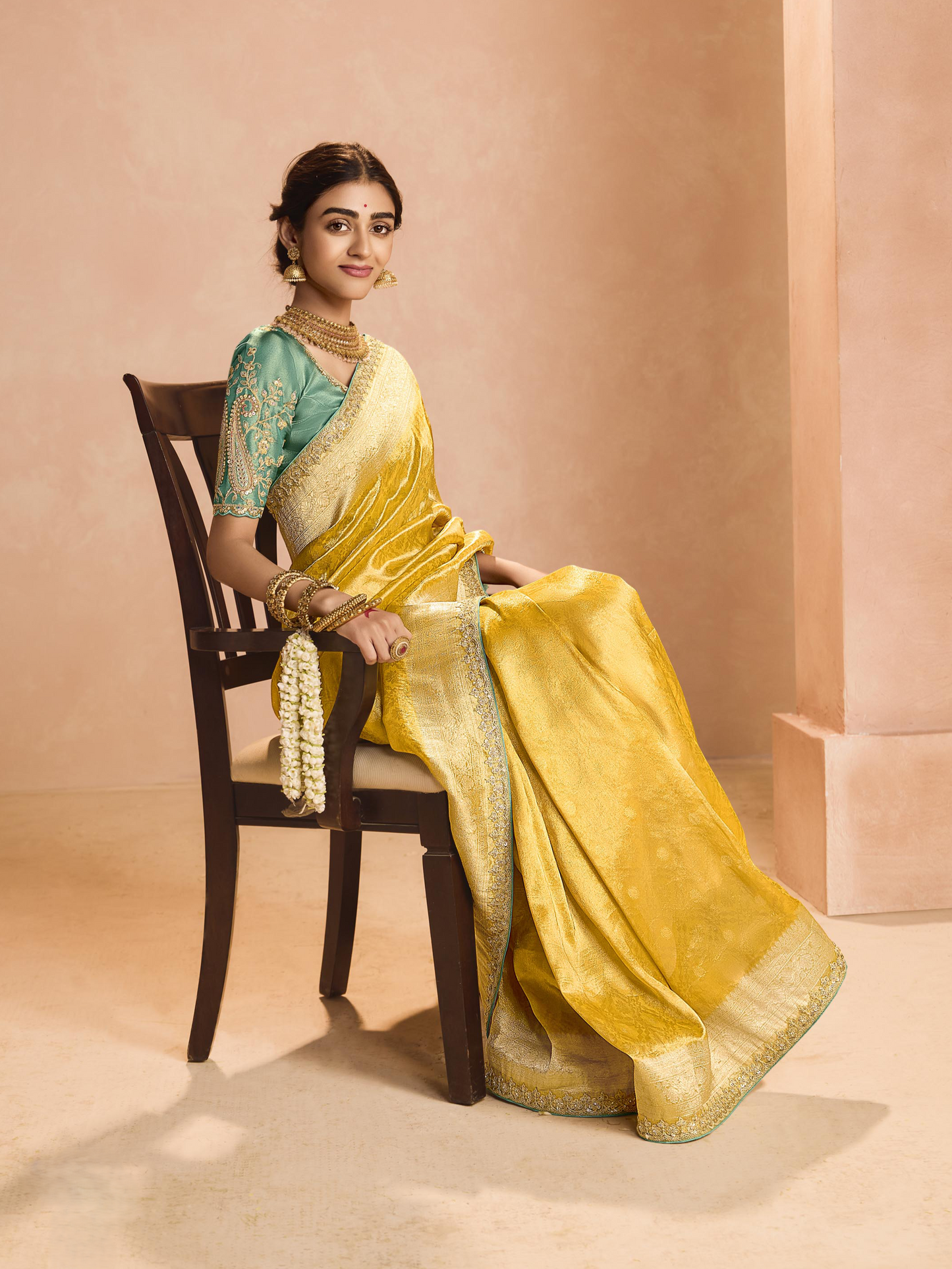 Dhiyona KM Women Yellow Kanjivaram Silk Saree With Sea Green Embroidered Blouse