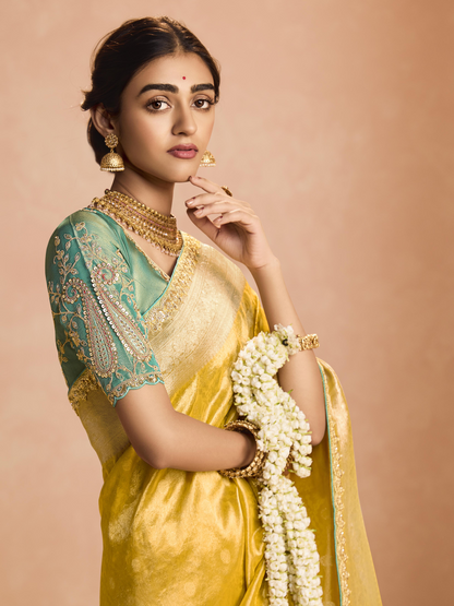 Dhiyona KM Women Yellow Kanjivaram Silk Saree With Sea Green Embroidered Blouse