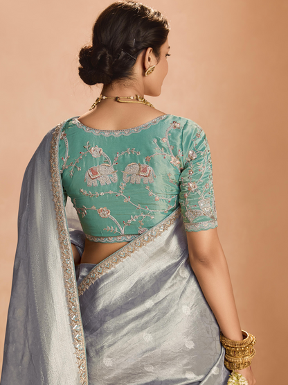 Dhiyona KM Women Elegant Silver Kanjivaram Silk Saree With Sea Green Embroidered Blouse