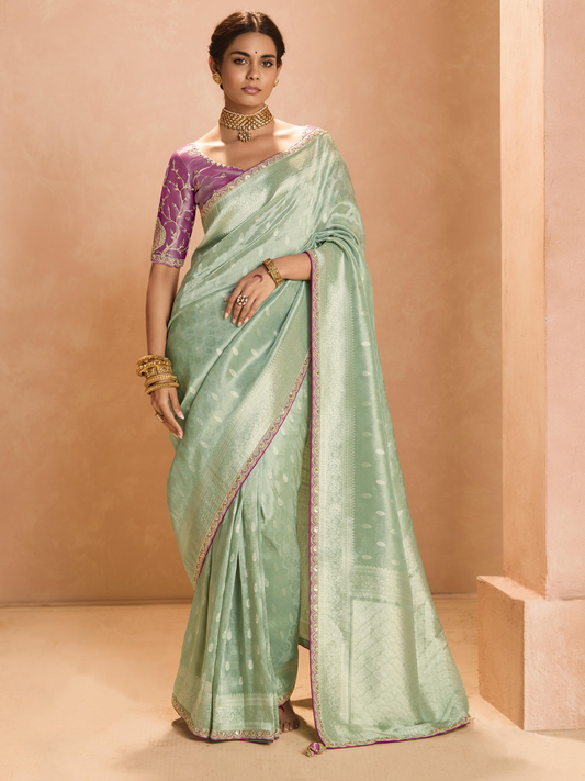 Dhiyona KM Women Mint Green Kanjivaram Silk Saree With Elegant Purple Embroidered Blouse “ A Dreamy Delight