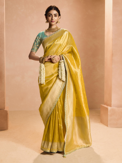 Dhiyona KM Women Yellow Kanjivaram Silk Saree With Sea Green Embroidered Blouse