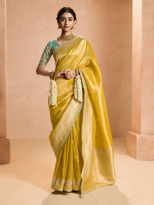 Dhiyona KM Women Yellow Kanjivaram Silk Saree With Sea Green Embroidered Blouse
